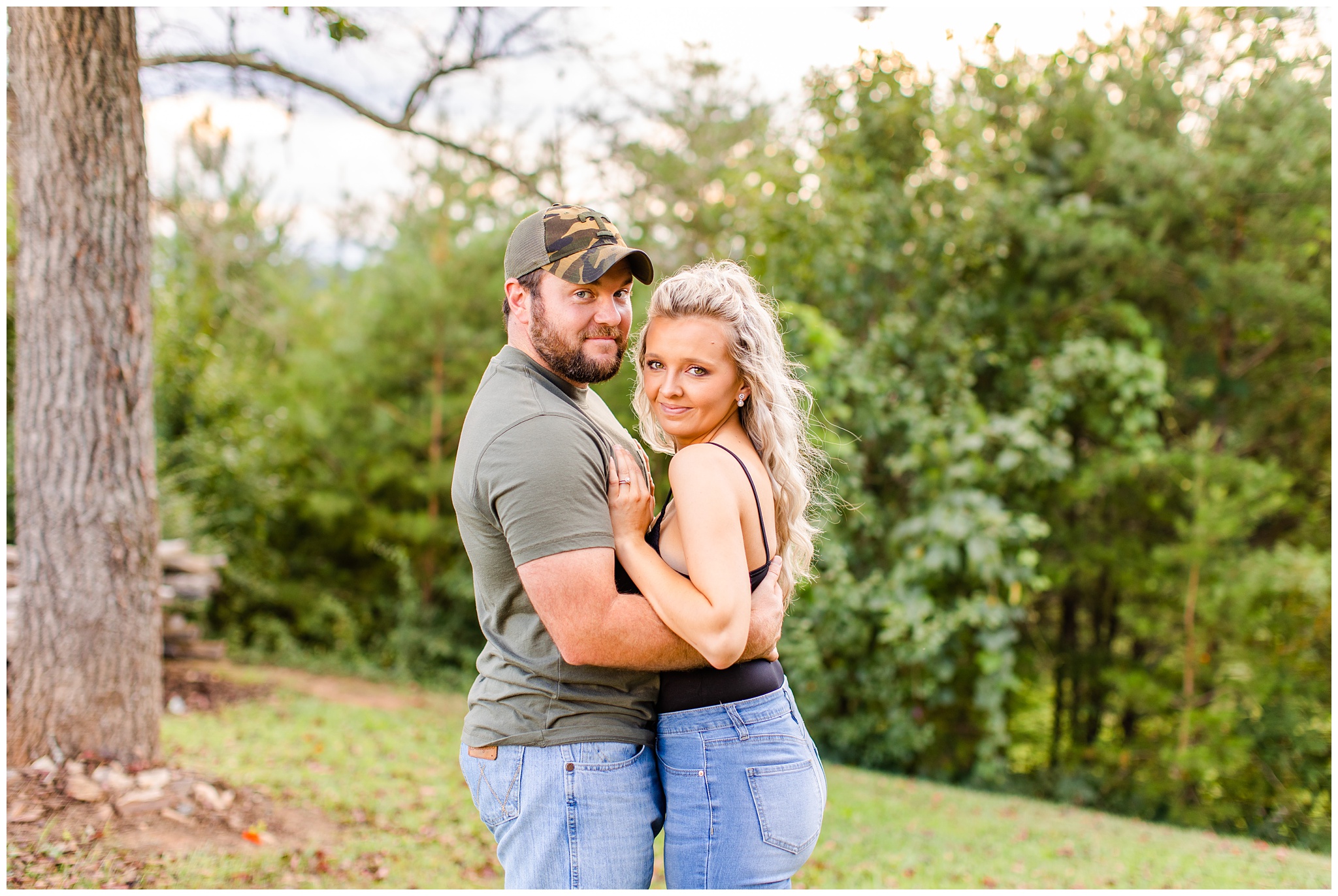 couple poses outdoors for their anniversary session