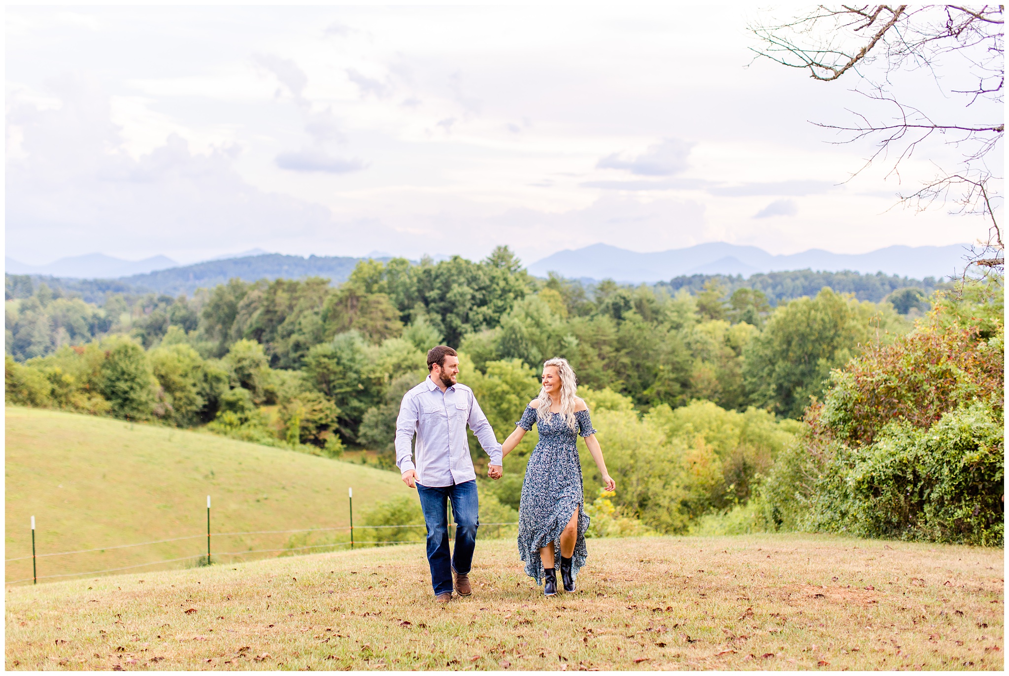 couple walks on hillside for photo shoot