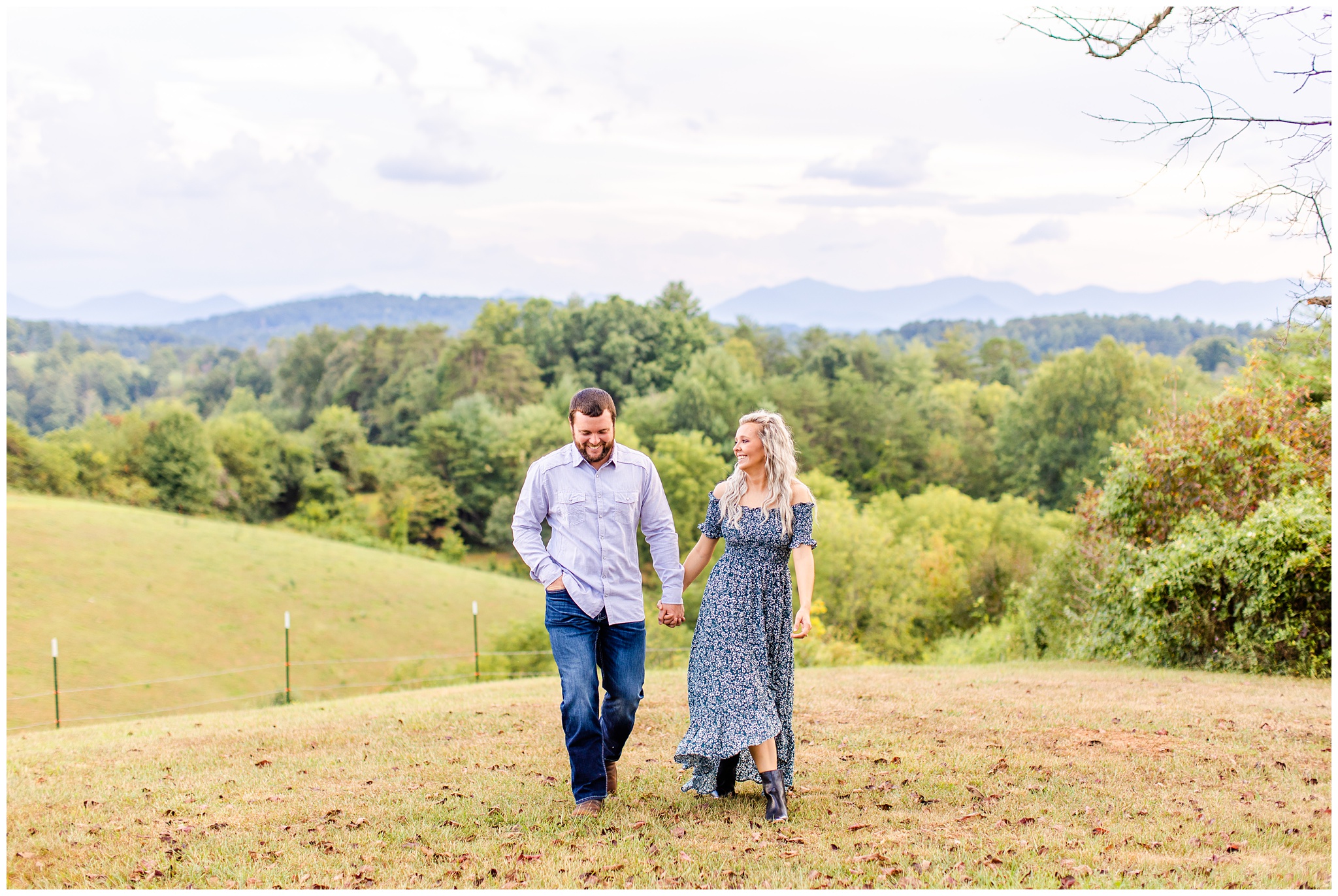 couple walks on hillside for photo shoot