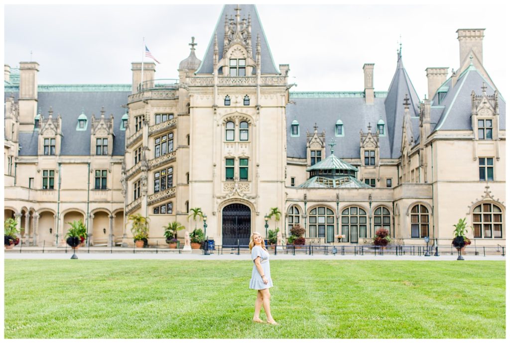 high school senior poses in front of the Biltmore Estate
