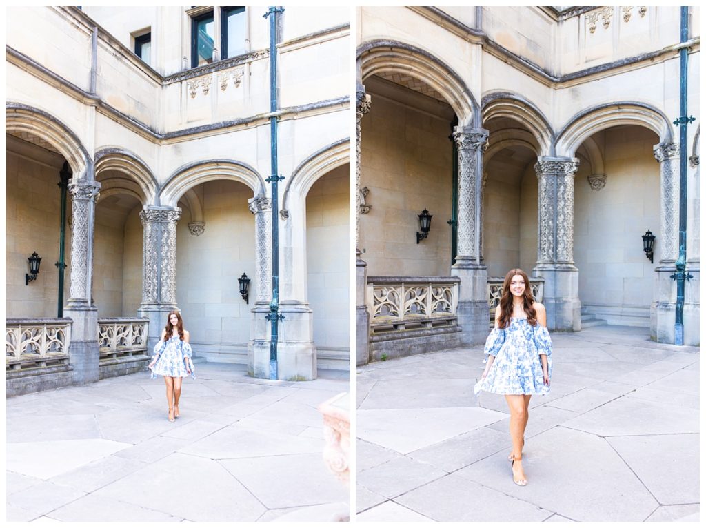 girl in blue and white dress poses for Asheville senior photographer at the Biltmore