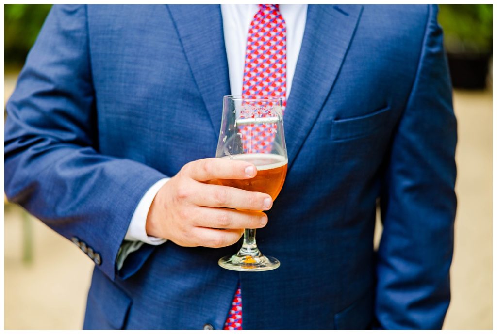 groomsmen holding beer at downtown Asheville wedding