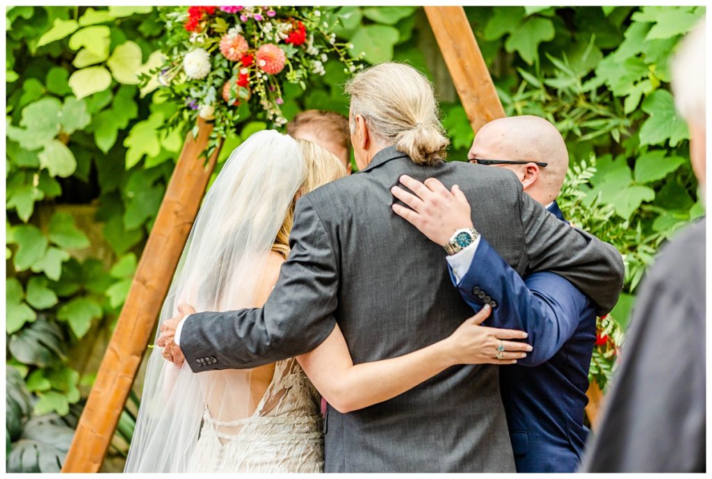 group hug at ceremony