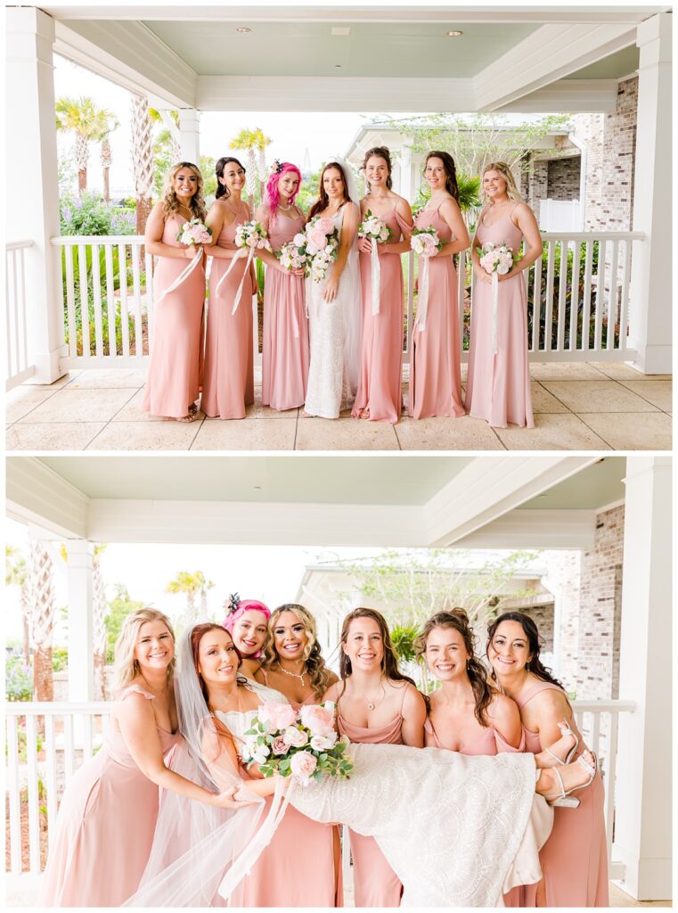 bridesmaids in pink dresses holding the bride