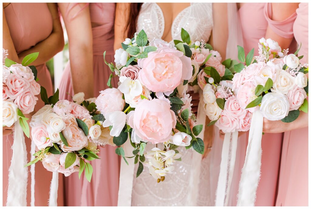 pink and white floral photos at beach wedding