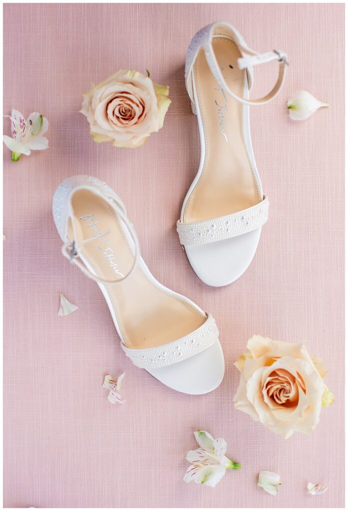 wedding day heels flat lay with pink florals