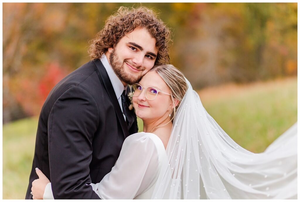 bride and groom posing for couple portraits at Chestnut Ridge wedding venue
