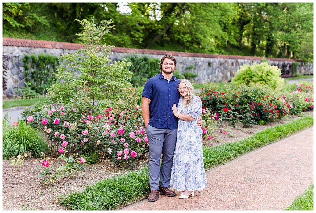 couple posing for engagement photos at biltmore gardens